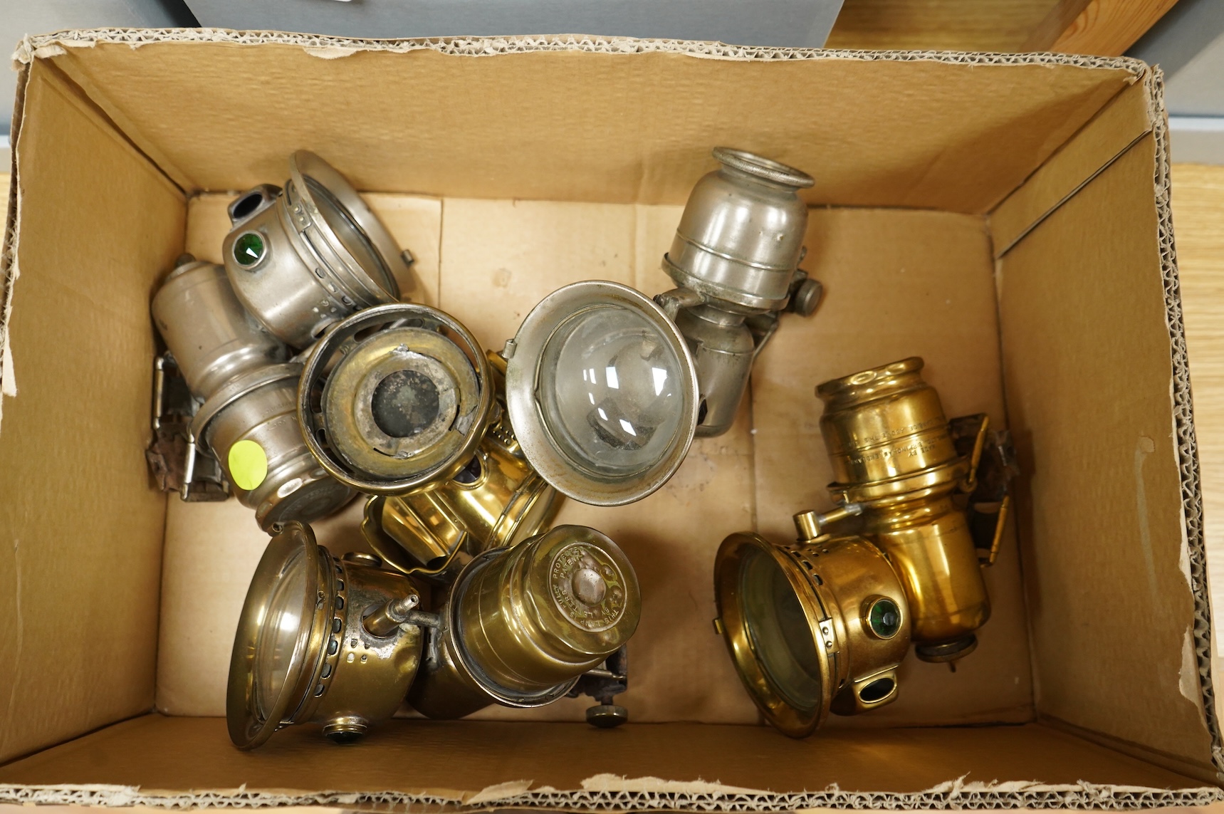 An early 20th century Lucas ‘King of the Road’ brass carriage lamp, 35cm high, together with five brass motorcycle lamps by Lucas, etc.